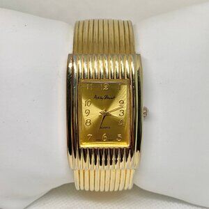 Ashley Stewart women gold tone watch quartz case size 25mm cuff size 6” running
